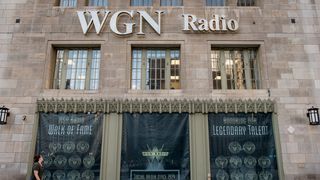 Photo of the front of a building that says WGN Radio